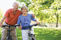 Photo of couple on bicycles.